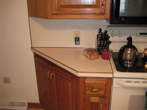.build a kitchen counter back splash with formica right against the wall with a small piece of trim does anyone know if there is a feasible way to build a kitchen counter back splash with formica i need to redo a counter top over an old existing counter top which has the cap and cove detail already. Tiling Backsplash Over Laminate???? - Tiling, ceramics ...