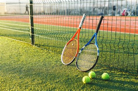 Premium Photo Tennis Rackets On Grass