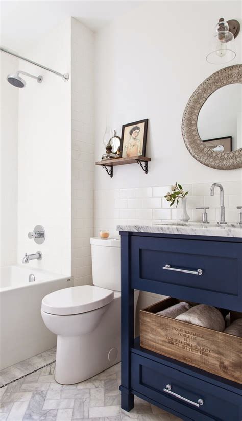 Our favorite element of this design scheme is actually the brass drawer pulls and door handles, and how nicely they pop against the navy wood. 5 Navy & White Bathrooms - The Inspired Room