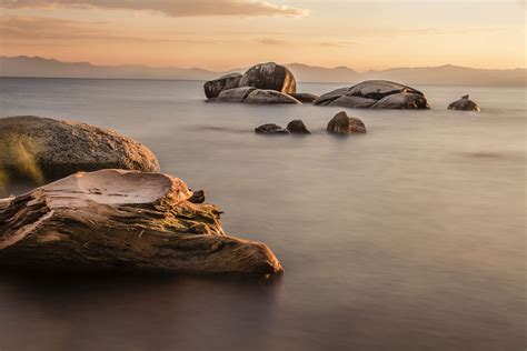 Rock Formations On Body Of Water During Sunset Lake Tahoe Hd Wallpaper