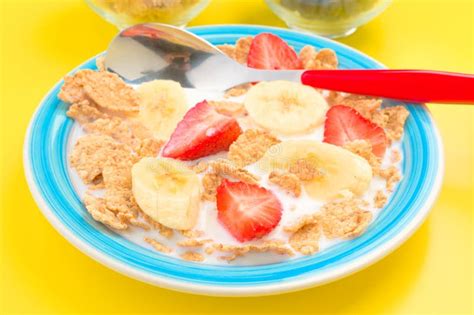 Bowl Of Cereal With Milk And Sliced Banana Strawberry Stock Photo