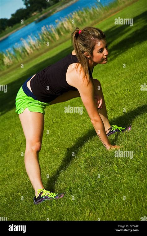 Young Woman Stretching Her Hamstrings And Groin Stock Photo Alamy