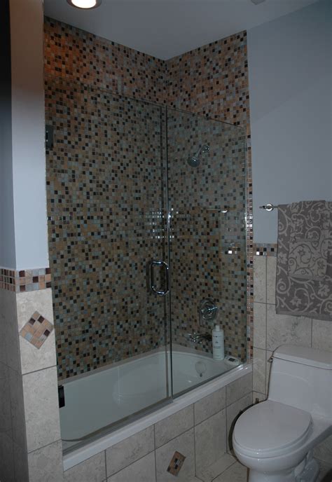 Frameless glass bathtub screens are a great way to break up the space in the bathroom without creating a sense of so much enclosure. Frameless clear glass shower enclosure | Glass shower ...