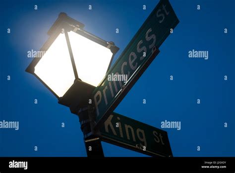 Street Signs At Twilight Charleston South Carolina Usa Stock Photo