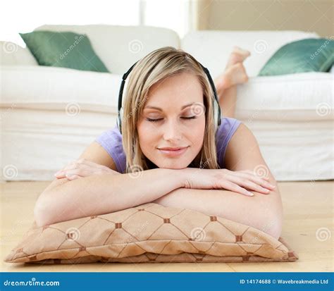 Relaxed Woman Listening Music Lying On The Floor Royalty Free Stock