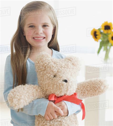 Portrait Of Girl Hugging Teddy Bear Stock Photo Dissolve