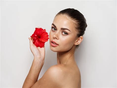 Premium Photo Pretty Woman Nude Shoulders Red Flower Cropped View Studio