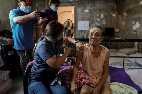 Philippine Heath Workers Bring Vaccines To The Housebound In Manila