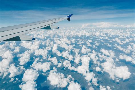 Airplane Wing Over Clouds In Sky · Free Stock Photo