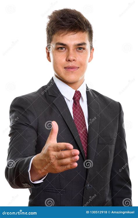 Young Handsome Businessman Giving Handshake And Looking At Camera Stock