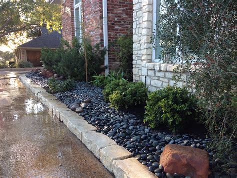 Some of the most reviewed products in black landscape rocks are the rain forest 20 lb. Here we used river rock instead of mulch. Makes for a ...