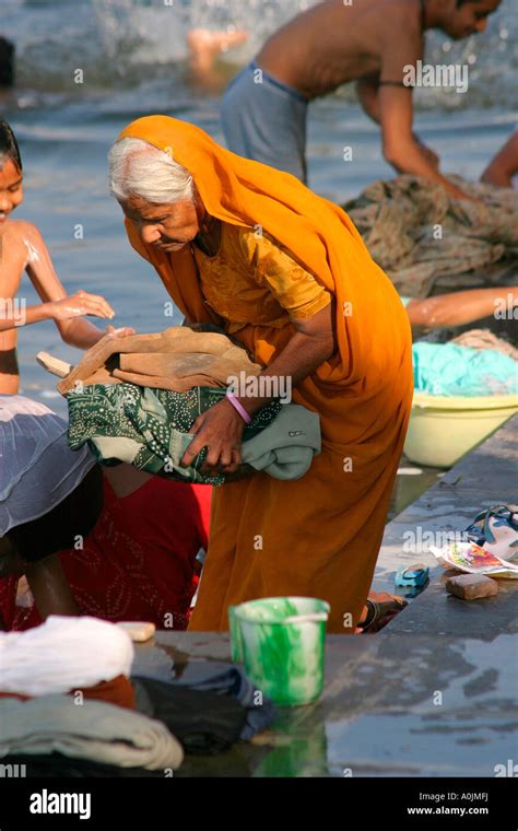 Rajasthani Woman Washing Clothes At The Bathing Ghats At Udaipur
