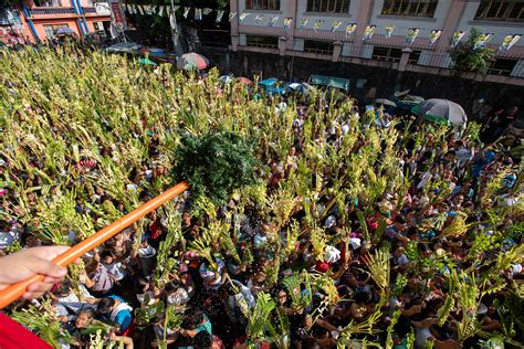 In Photos From Churches To Jails Filipinos Mark Palm