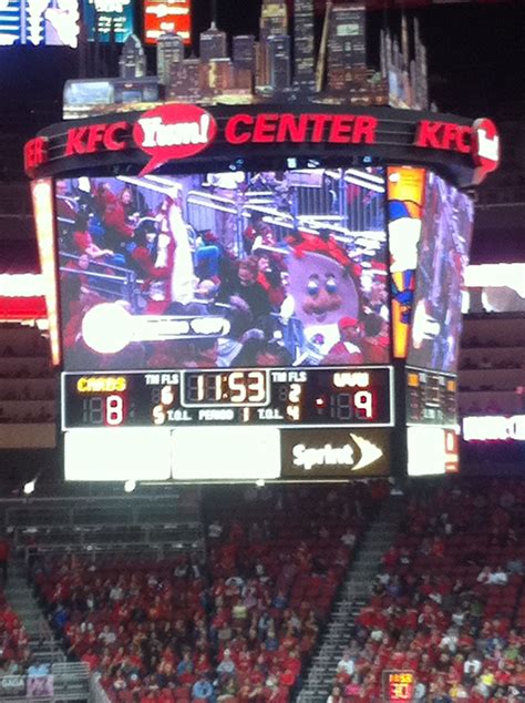 an electronic scoreboard at a basketball game