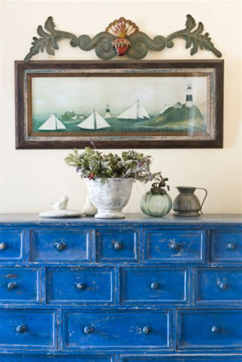 When applying the primer, use a paint roller and make long even strokes. How to Paint Over Stained & Varnished Furniture | Hunker