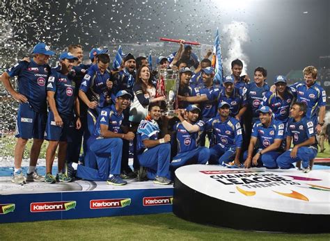 Mumbai Indians Pose With The Champions League Trophy