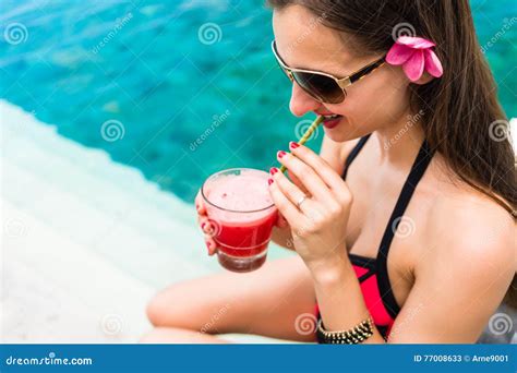 Tourist Woman In Red Bikini Drinking Cocktail At Beach Stock Photo