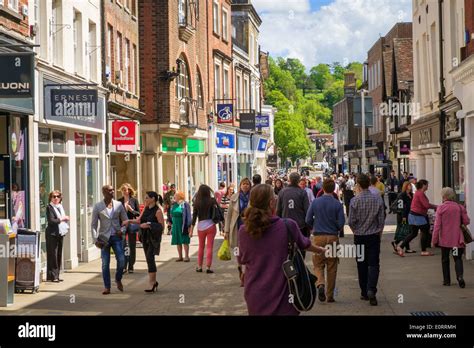 Busy shopping street UK, with shops in Winchester, Hampshire Stock