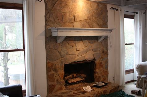 Painting the fireplace would be an easy way to tone down all the browns. erin's art and gardens: painted stone fireplace before and ...