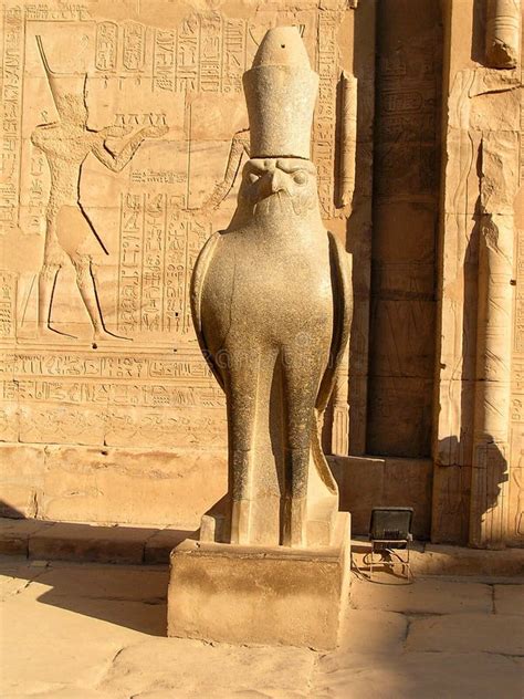 statue of hor behdeti or horus von edfu in the courtyard of the temple of edfu egypt stock