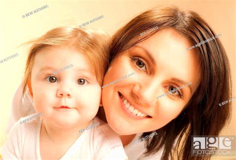 Woman Looking After Her Child Stock Photo Picture And Rights Managed