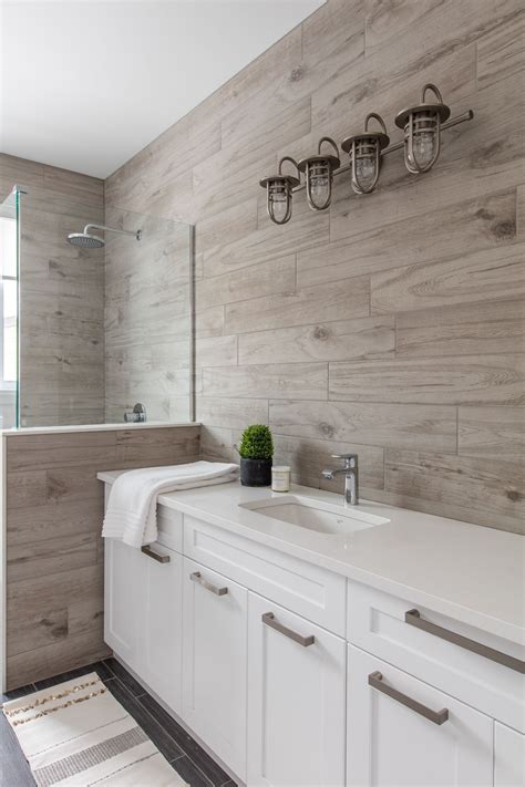 Browse photos of bathroom renovations and designs, and discover bathroom ideas for baths, toilets, showers, vanities and more. Wood look tiled wall is the highlight in this beautiful ...
