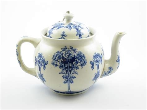 A Blue And White Tea Pot With A Lid