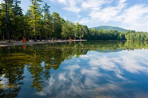 Created by meteors, the lake has a white sand bottom and its water is unbelievably crystal clear. Dry Sands & Moonlit Waters - NH State Parks