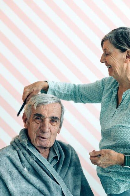 Premium Photo Wife Cuts Hair To Elderly Husband
