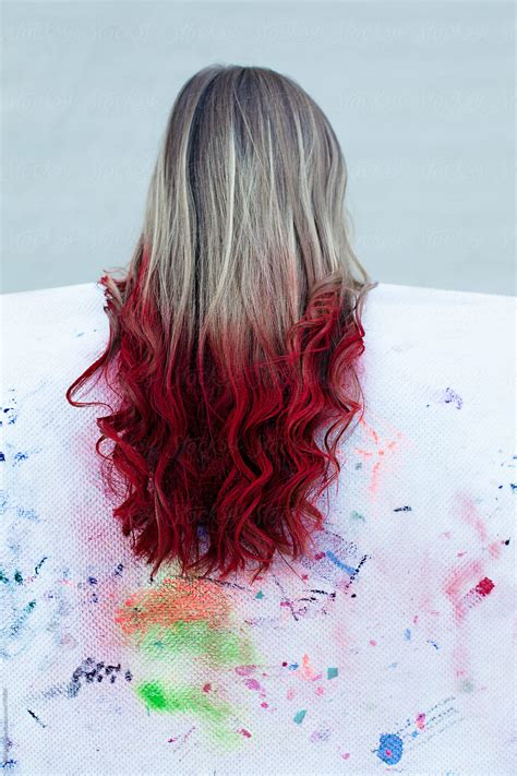 Long Blonde Hair With Red Color Sprayed On The Ends Dip