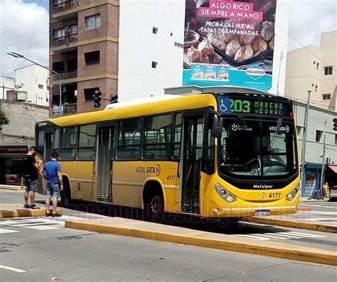 A Yellow Bus Is Parked On The Side Of The Road