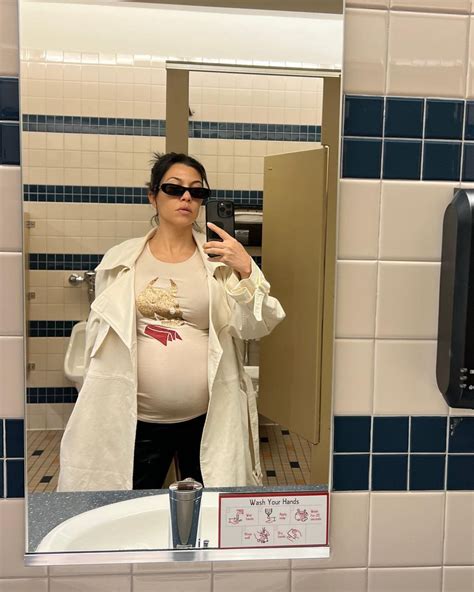 Kourtney Kardashian Flaunts Bare Baby Bump In Mirror Selfies And Hints