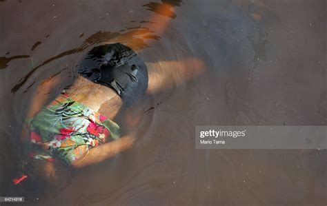 The Dead Body Of A Female Victim Of Hurricane Katrina Floats In The