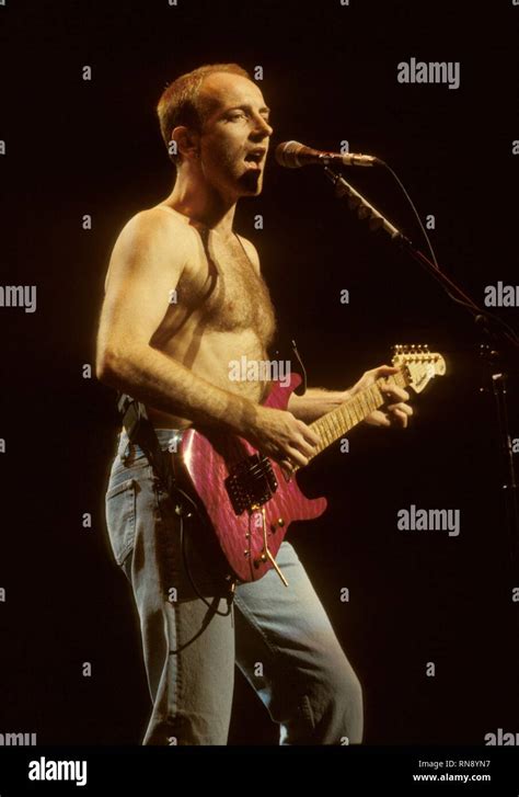 Def Leppard Guitarist Phil Collen Is Shown Performing On Stage During A