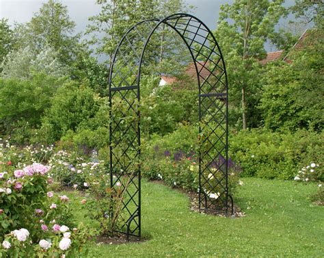 My favorite part of this type of cattle panel arch is that it costs around $40 for each arch! 6' 7" Bagatelle Garden Arch in 2020 | Garden arch trellis ...