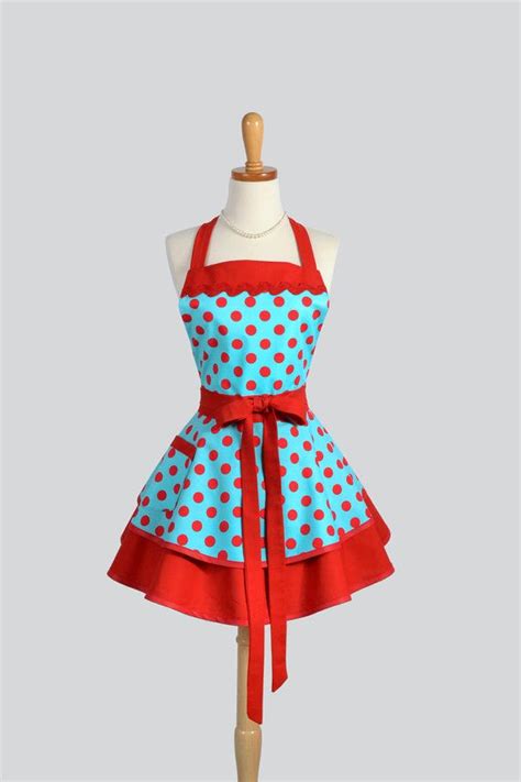 a woman s apron with red and blue polka dots on it tied to a mannequin
