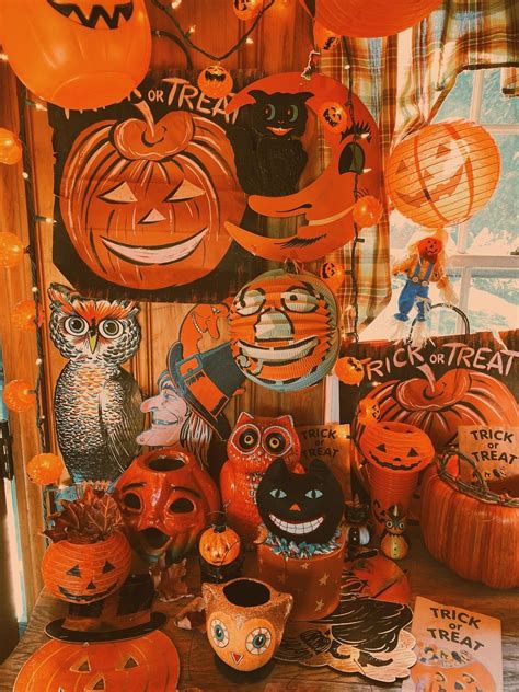 Pumpkins And Other Halloween Decorations Are On Display