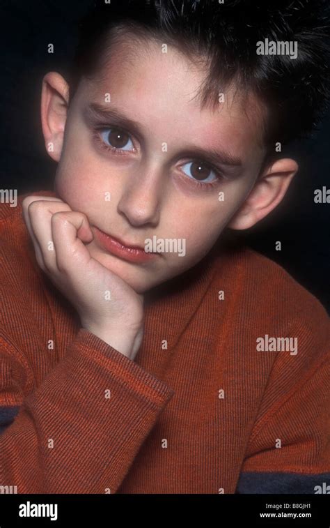 Boy Resting Chin Hand Hi Res Stock Photography And Images Alamy