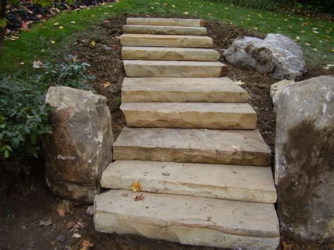 Sienna Steps Providing Access To The Backyard With Boulder Accents