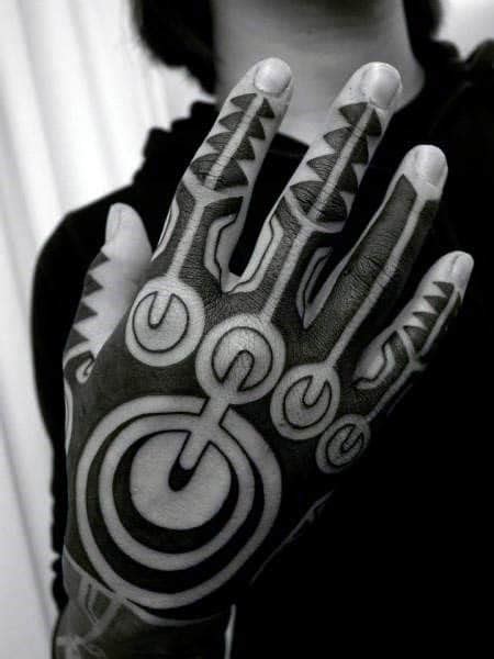A tribal design is something that you don't want to get off your list. 40 Tribal Hand Tattoos For Men - Manly Ink Design Ideas
