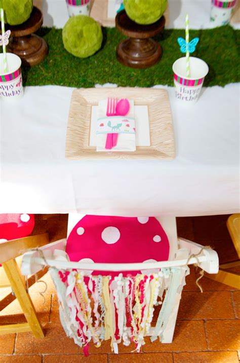 A Table Set Up With Pink And White Decorations