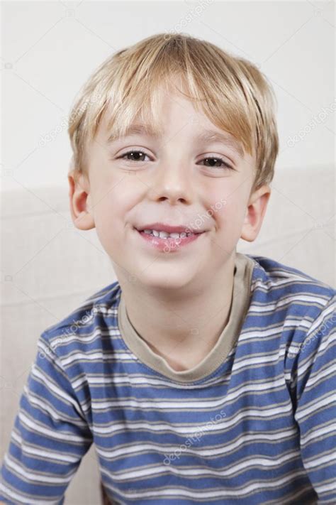 Cute Young Boy Smiling Stock Photo By ©londondeposit 34012249