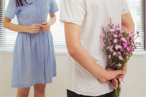 Couple In Love Romantic Man Giving Flowers To His Girlfriend Stock