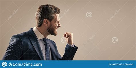 Aggressive Man Businessman In Suit Make Threaten Gesture Shaking Fist