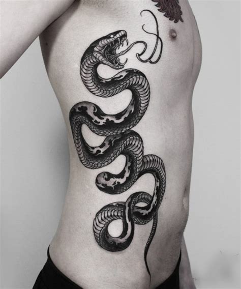 Snake tattoo design on shoulder image. 40 Realistic Snake tattoo Design and their Meaning - Four ...