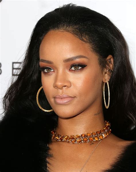 Rihanna Wears Hoop Earrings Dark Lip Liner And A Choker Necklace For A