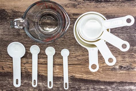 Set Of White Measuring Cups Measuring Spoons And Measuring Glass Use