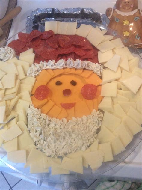Using fruit means you don't have to worry about serving and eating unhealthy desserts during the holiday time. Santa Face cheese platter | Cheese platters, Christmas ...