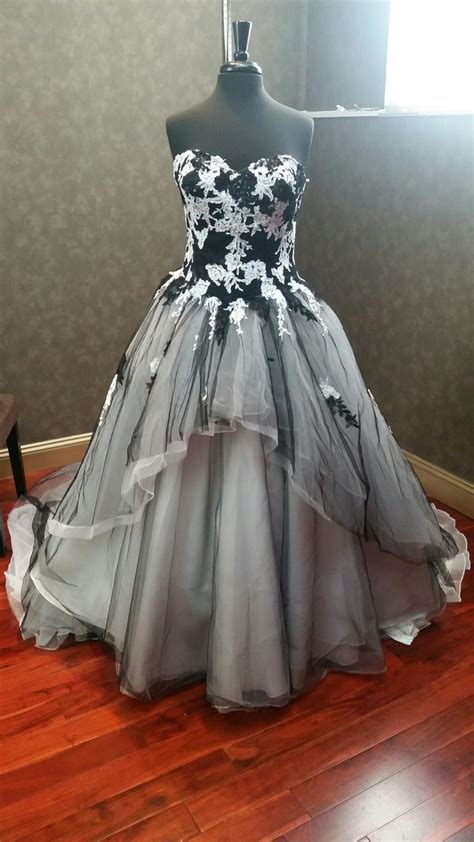 This incredible dress is so stunning that it makes you forget that it's not this dress would be perfect for that edgy bride who is always on the hunt for the next big thing in the. Black and White Wedding Dress with Tulle and Lace