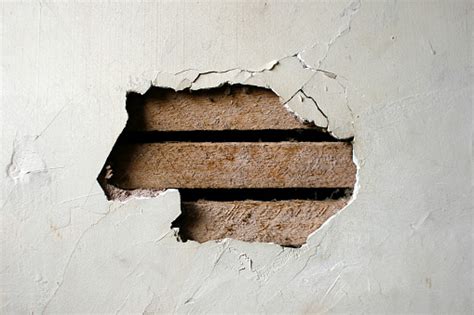 Hole In Plaster Wall Exposed Wood Paneling Stock Photo Download Image